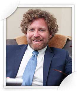 Pensacola criminal attorney Jason Cromey standing with his hands in his pocket.